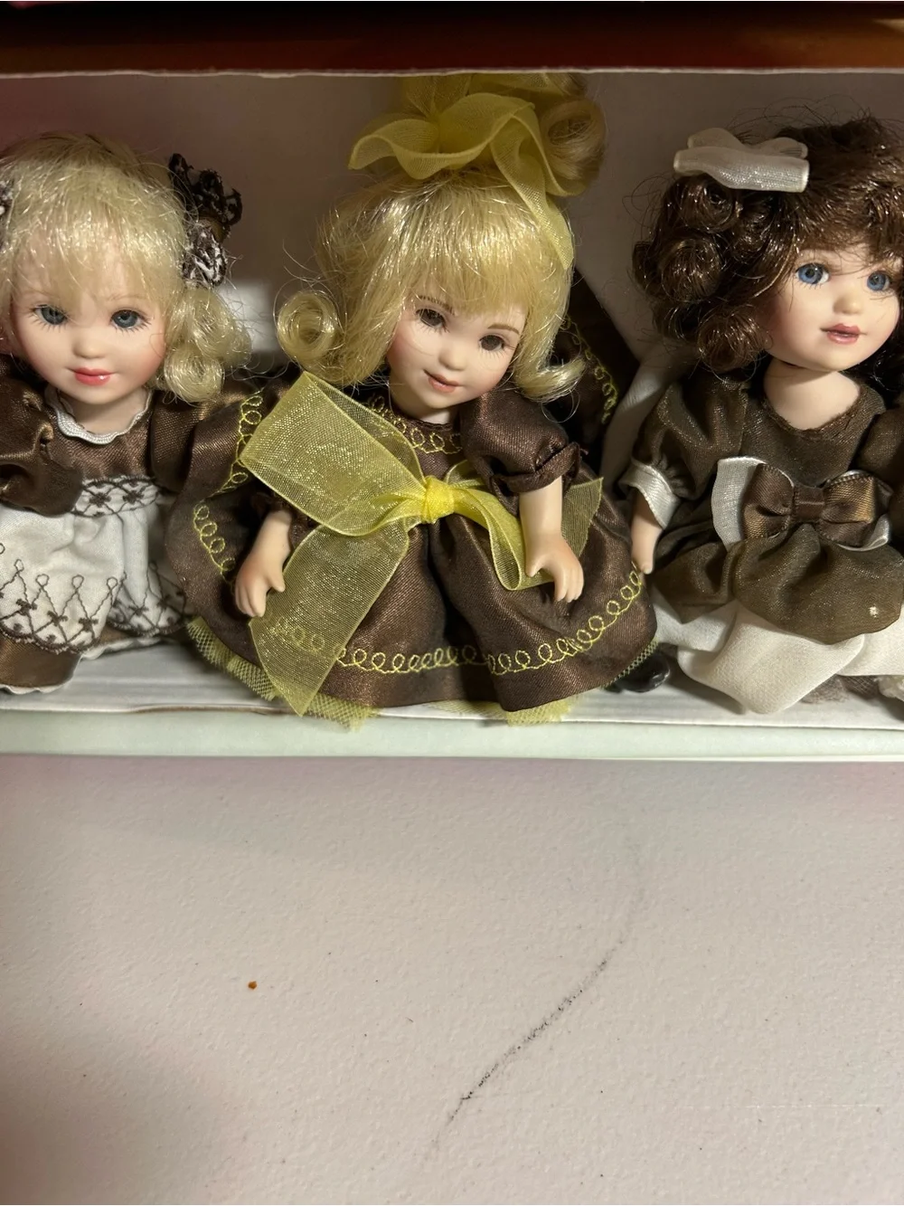 Charisma Porcelain Doll Trio in Brown, Cream & Yellow Accents